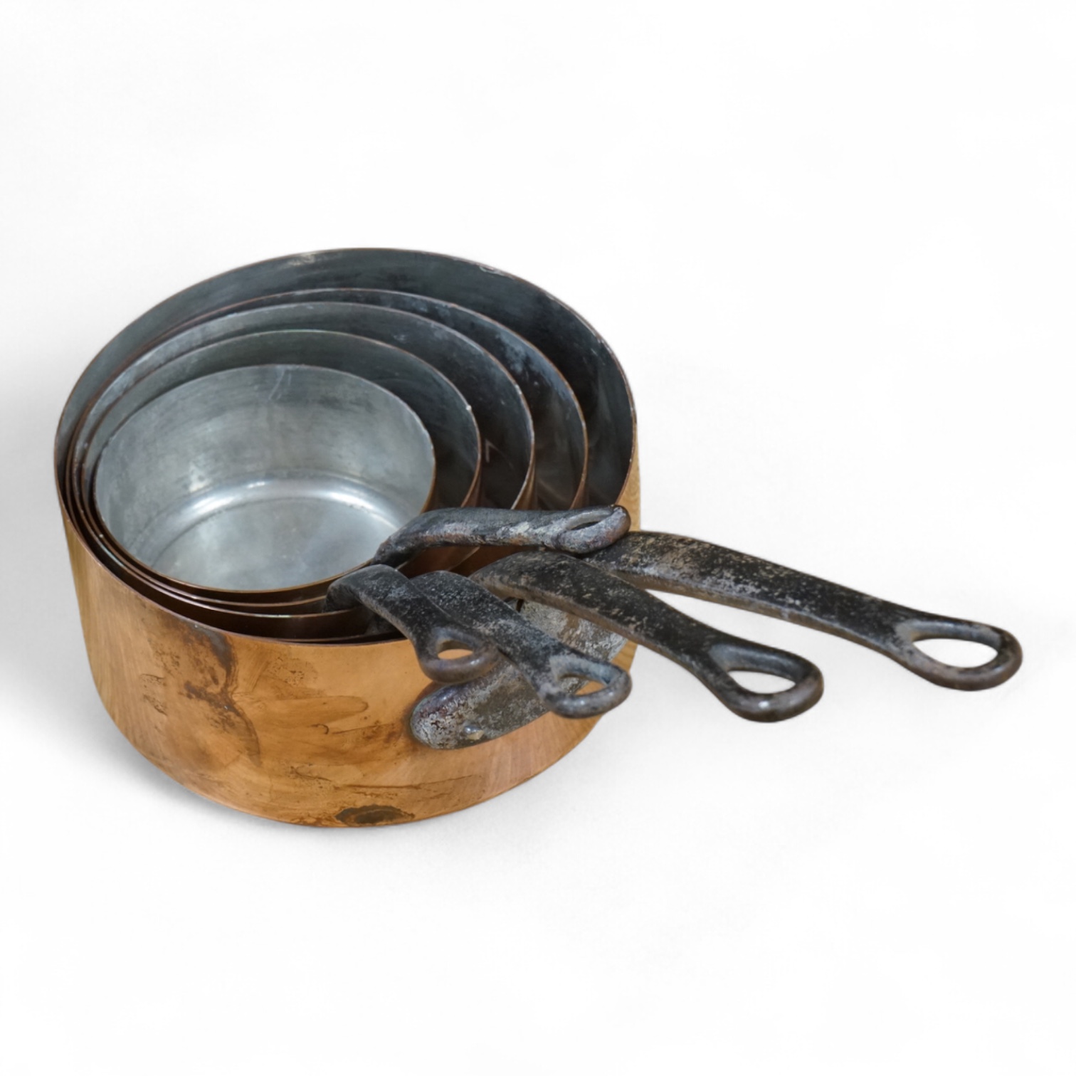 A set of five French iron handled graduated copper saucepans, gargest 20 cm diameter. Condition - good